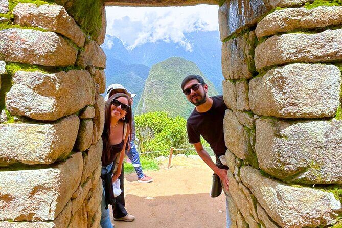 2 Day Machu Picchu & Sacred Valley Tour from Cusco /Train & Guide - Day 2 Machu Picchu at first light: buses, gates, and guided walking