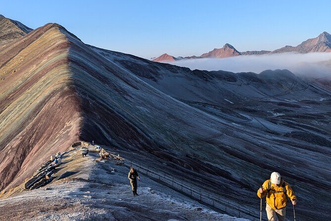 4-Day Tour in Ausangate Trek and Rainbow Mountain of Cusco - Day 3: Puca Pass summit, Warmisaya (Pitumarca), and Rainbow Valley at sunset