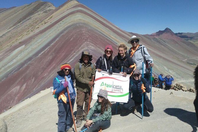 Montaña de 7 Colores Vinicunca full day - Once you reach the summit area: alpacas, Ausangate views, and vendors