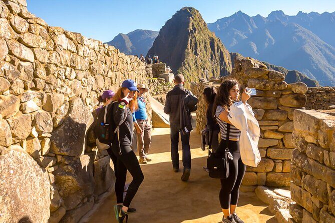One Day Train Trip to Machu Picchu from Cusco - Aguas Calientes connection and the climb decision: bus, foot, and timing